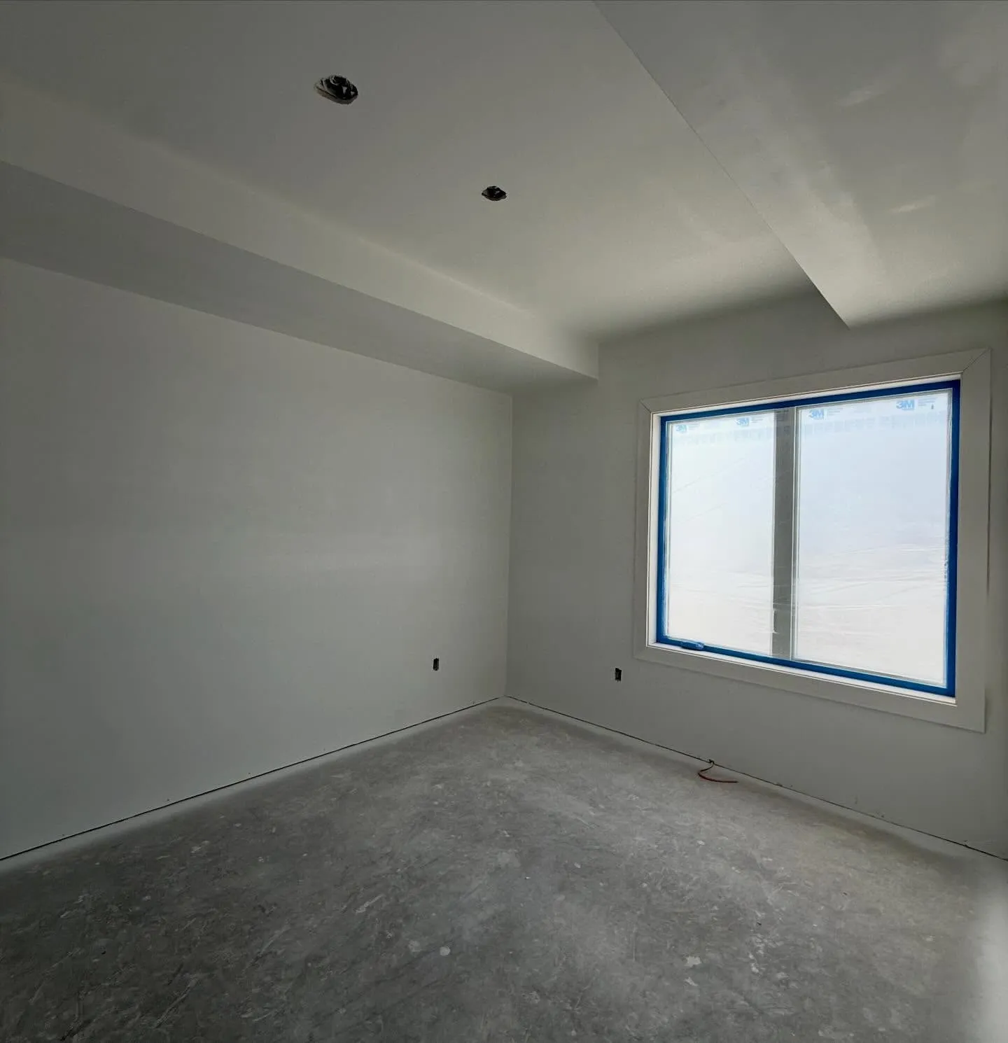A finished room: fresh paint, window casing and baseboard