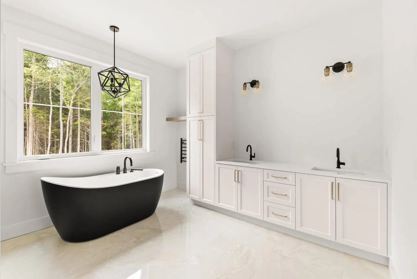 A bathroom with a black freestanding tub against white cabinetry
